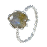 Lakshmi solitaire grey ring with twisted silver band and polished grey gemstone centerpiece